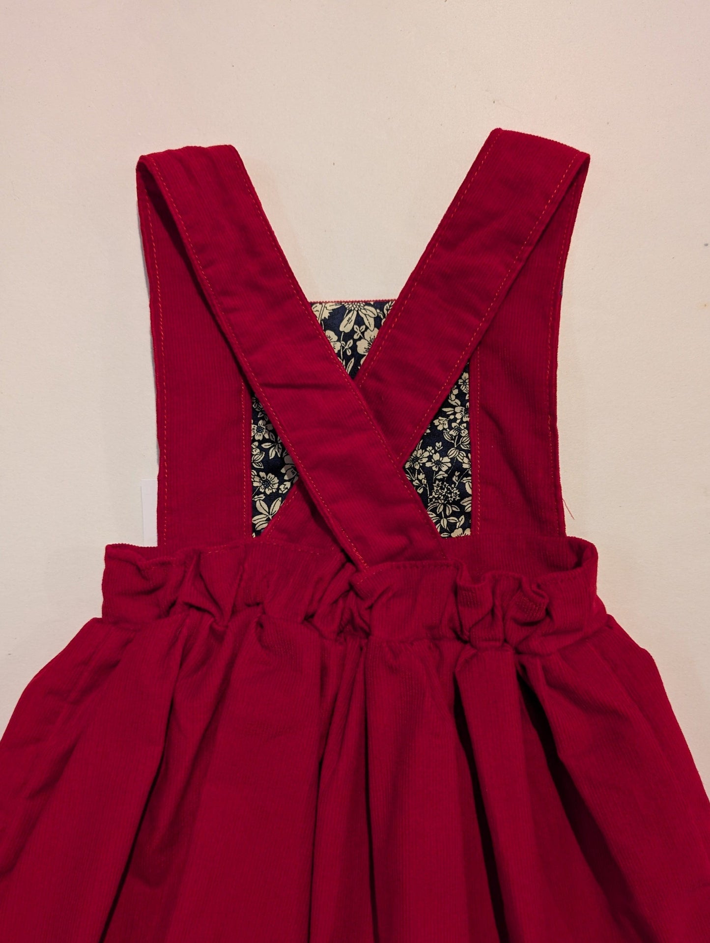 RED NEEDLECORD PINAFORE DRESS