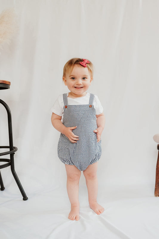NAVY GINGHAM DUNGAREE ROMPER