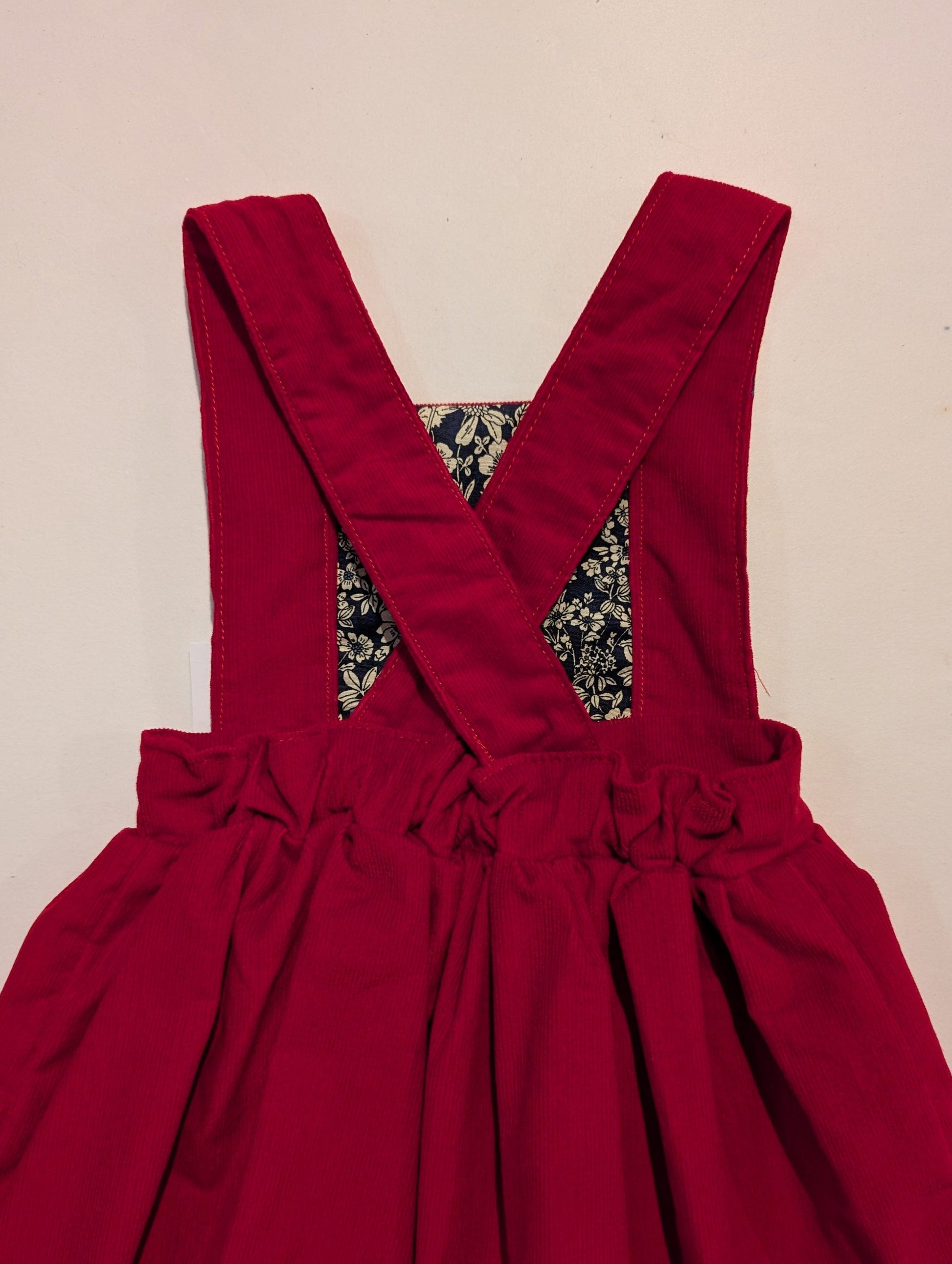 RED NEEDLECORD PINAFORE DRESS